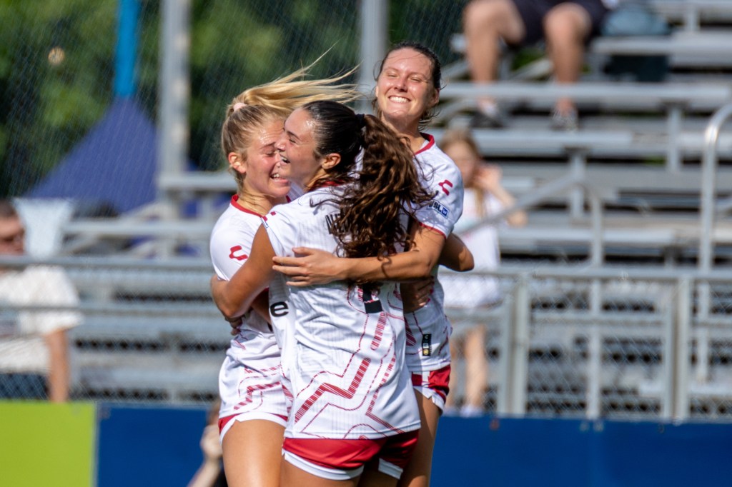 Tanum Nelson (right) celebrates with teammates Alexis Tylenda and Olivia Damico after scoring the first hat trick in Pittsburgh Riveters history in the team's 3-0 win over FC Buffalo on June 8, 2025 at Highmark Stadium in Pittsburgh. (Photo: Chris Cowger/Riveters SC)