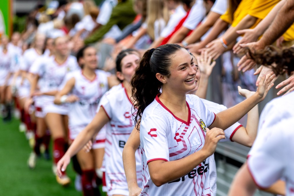 Pittsburgh Riveters forward Kennedy Neighbors leads a line of players thanking fans after their 3-0 win over FC Buffalo on June 8, 2025 at Highmark Stadium in Pittsburgh. (Photo: Chris Cowger/Riveters SC)