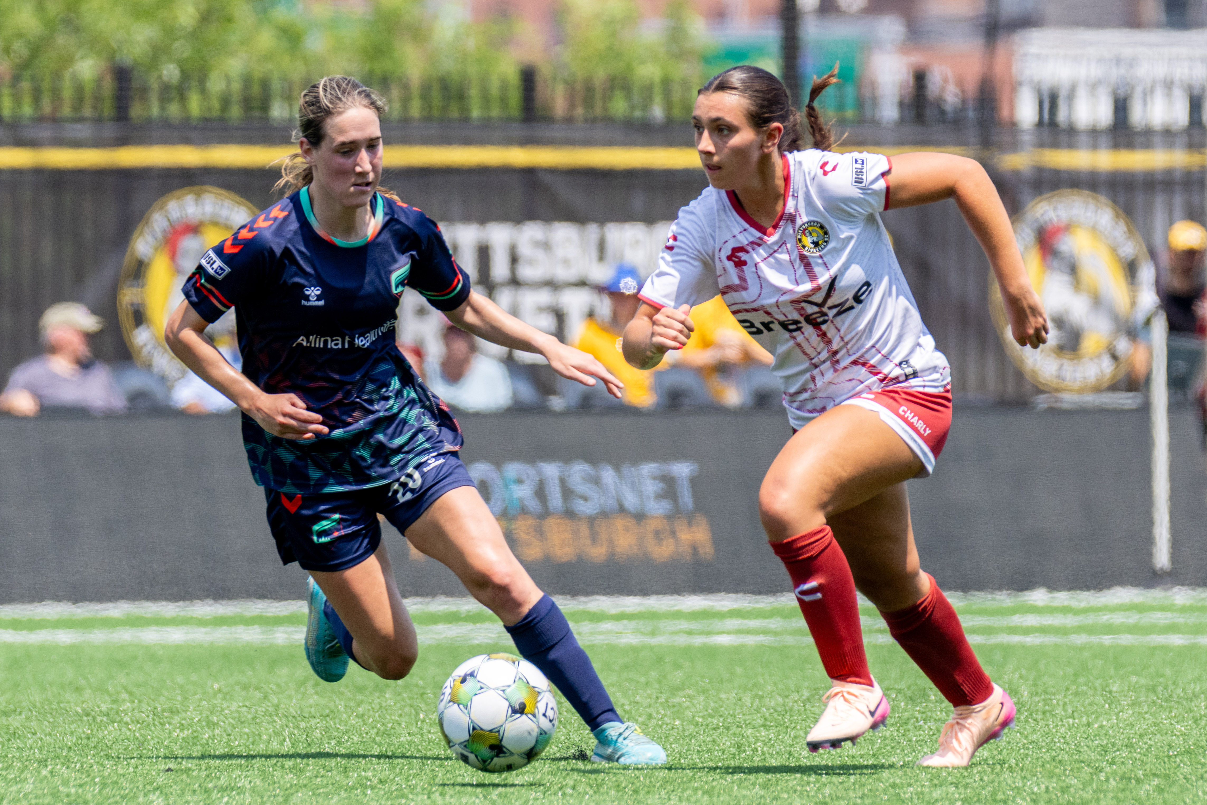 Pittsburgh Riveters defender Natalia DiSora evades Catherine Rapp of the Minnesota Aurora in the Riveters' 2-0 loss in the USL W League Playoffs on July 4, 2025 at Highmark Stadium in Pittsburgh. (Photo: Chris Cowger/Riveters SC)