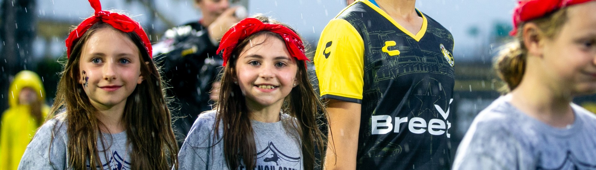Olivia Damico walks out onto the field joined by young girls players prior to the Pittsburgh Riveters' match against Flower City 1872 on May 30, 2025 at Highmark Stadium in Pittsburgh. (Photo: Chris Cowger/Riveters SC)
