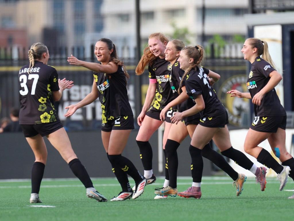 Pittsburgh Riveters players celebrate the opening goal by Piper Coffield (center) in the team's 5-0 win over FC Buffalo on May 16, 2026 at F.N.B. Stadium in Pittsburgh. (Photo: Chris Cowger/Riveters SC)