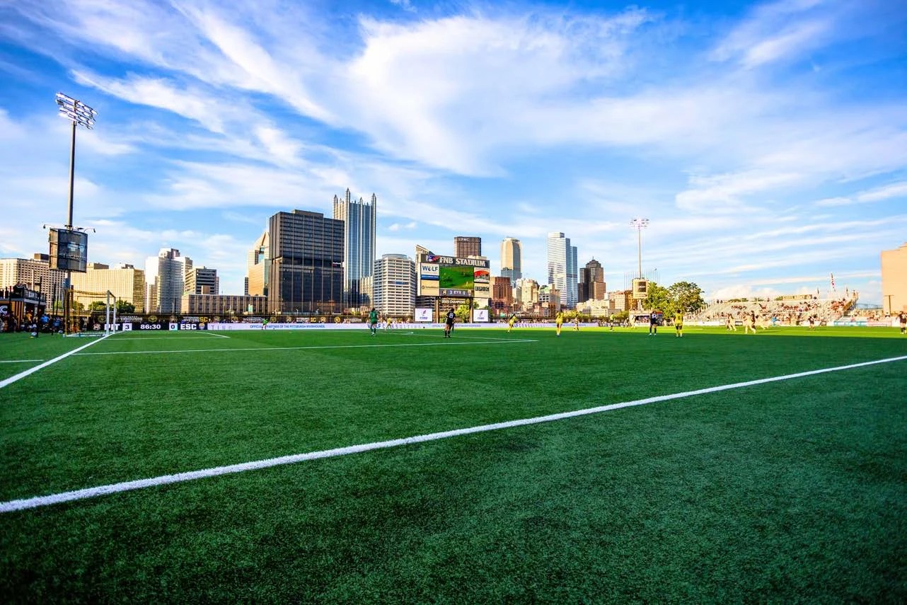The F.N.B. Stadium field and grandstand with the Pittsburgh skyline across the river